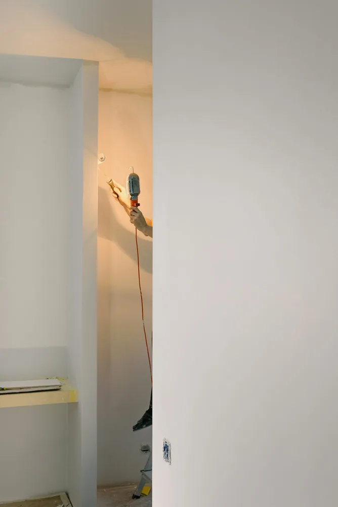 Tradesperson carrying out general property maintenance in a home
